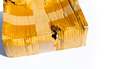 Wall Mural - Damaged cardboard box with hole, Broken and wet product packaging