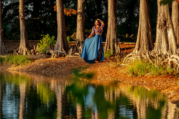 Wall Mural - A Lovely Brunette Model Poses Outdoor While Enjoying The Fall Weather