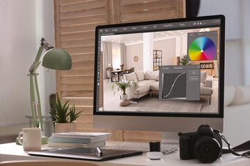 Poster - Retoucher's workplace. Computer with photo editor application, camera and graphic tablet on table in office