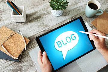 Wall Mural - tablet with blog text the on screen. social network, communication and internet marketing concept.