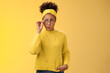 Unsure thoughtful hesitant cute african-american millennial teenage girl in round glasses sweater headband solving riddle mind look up doubtful touch eyewear smirking, thinking yellow background
