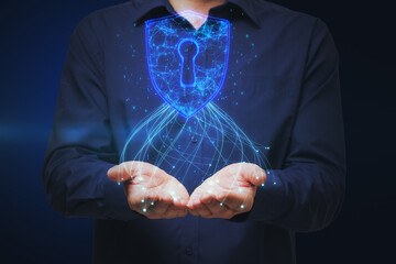 Poster - Close up of male hands holding glowing blue padlock hud on dark background. Safety, web security and future concept.
