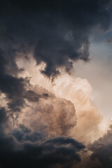 Wall Mural - vertical shot of menacing clouds during sunset