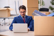 © Elnur - Young male employee in relocation concept