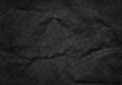 © nata777_7 - Crumpled black paper for background usage