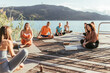 © Westend61 - Men and women talking to female instructor during yoga class