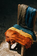 Colorful dyed threads on wooden chair. Colourful of dyed silk cotton from the natural colour.