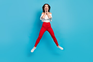 Poster - Full length body size view of attractive cheerful lucky amazed girl jumping having fun isolated over bright blue color background