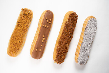 Sticker - Closeup of eclairs on a white surface