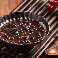 Wall Mural - Adzuki red bean soup on wooden table background.