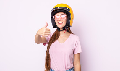 Poster - young pretty woman with a motorbike helmet.