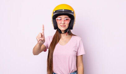 Poster - young pretty woman with a motorbike helmet.