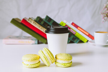 Wall Mural - set of macaroons with flowers and coffee cup in cafe