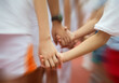 © xy - Group of children holding hands together..
