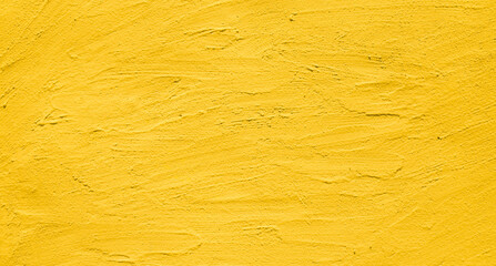 Wall Mural - Artistic creative vibrant yellow stucco wall background