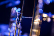 A trombone in a big band environment with a lot a of bokeh