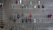 Car parking seen from above. Aerial view above multicolored cars on parking - drone view