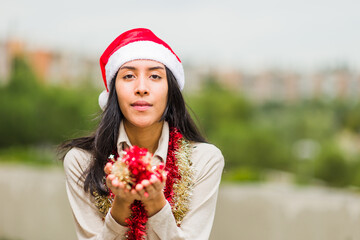 Sticker - christmas and new year lifestyle young latin woman. Hispanic celebrate holiday with santa hat.