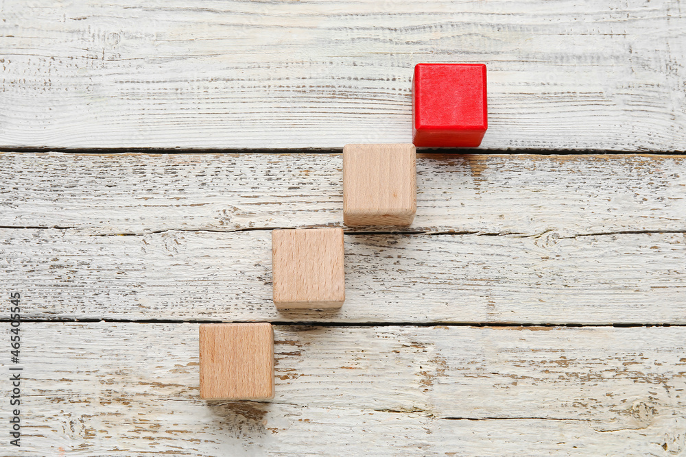 Cubes on white wooden background