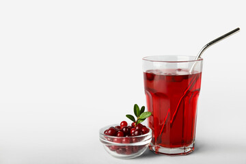 Wall Mural - Glass with healthy cranberry juice on light background