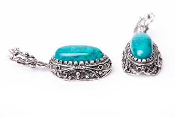 Silver jewelry earrings with chrysocolla isolated on white background.