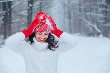 Poster - beautiful woman portrait outdoors in snowed forest