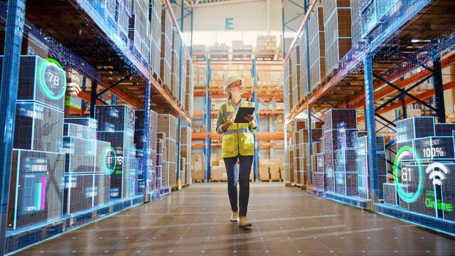 Fototapete - Futuristic Technology Retail Warehouse: Worker Doing Inventory Walks when Digitalization Process Analyzes Goods, Cardboard Boxes, Products with Delivery Infographics in Logistics, Distribution Center