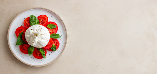Wall Mural - Italian burrata cheese with tomatoes and basil. Salad. Healthy eating. Vegetarian food.