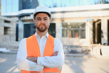 Wall Mural - Industrial theme: constructor standing at a site area.