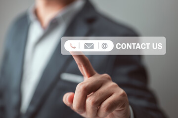 Fototapete - Concept of customer service, technology, the internet, and networking - a businessman presses buttons contact us on virtual displays.