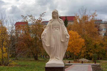 Wall Mural - Concrete white monument to the Mother of God in the park