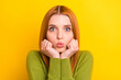 © deagreez - Photo of impressed red hair young lady hands face blow kiss wear green sweater isolated on yellow color background
