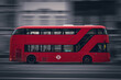 New Routemaster red doubledecker bus in Motion in London from the side