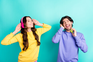 Canvas Print - Photo of young excited couple happy positive smile enjoy melody wireless headphones isolated over teal color background