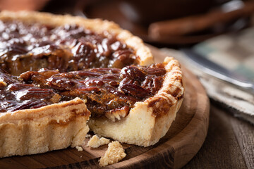 Wall Mural - Pecan tart on a wooden platter