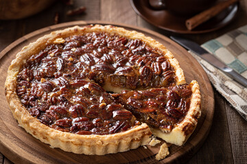 Wall Mural - Pecan tart on a wooden platter