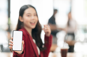 Wall Mural - woman hand holding smartphone and showing blank white screen.
