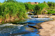 © olyasolodenko - View of Tokovsky waterfalls on the Kamenka river in Dnipropetrovsk region, Ukraine