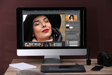 Fototapete - Retoucher's workplace. Computer with photo editor application, camera, smartphone and graphic tablet on table indoors