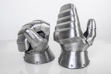 Steel Metal Gloves For Hand Protection. Iron Steel Ammunition, Personal Accessories For A Knight: Helmet, Chain Mail, Limb Protection. Concept Is A Reconstruction Of Battles.