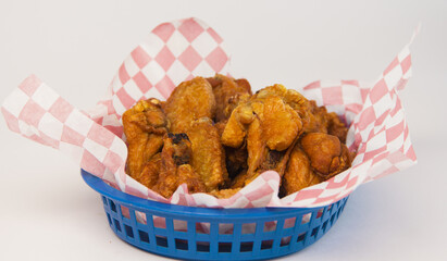 Chicken nuggets basket with checkered pattern paper on a white background