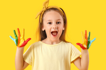 Sticker - Cute little girl with hands in colorful paint on yellow background