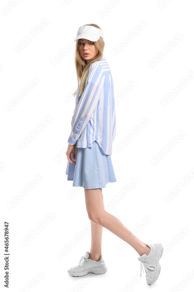 Fashionable woman wearing visor hat on white background