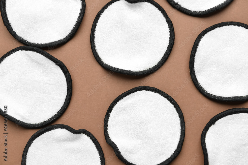 Reusable cotton pads on brown background