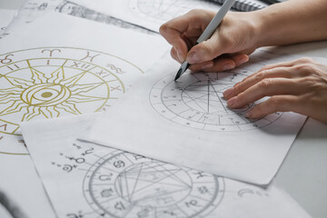 astrology. astrologer calculates natal chart and makes a forecast of fate.tarot cards, fortune telli