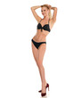 © vladimirfloyd - Young smiling blond woman posing in swimsuit