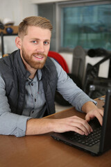 picture of technician typing on the laptop