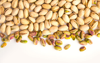 Wall Mural - roasted pistachio nuts on a white plate and a place for inscription