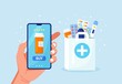 Human hand holding mobile phone for medicine online payment. Home delivery pharmacy service. Paper bag with pills bottle, medicines, drugs, thermometer inside. Medical assistance, health care concept.