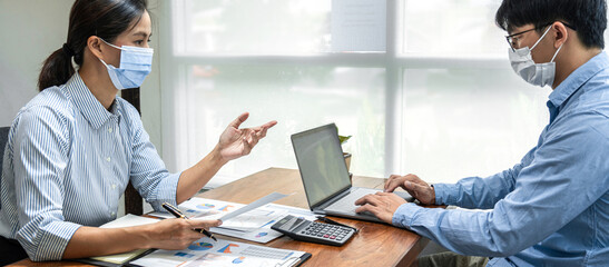 Aufkleber - Two business colleagues holding data document and typing business data on laptop during brainstorming